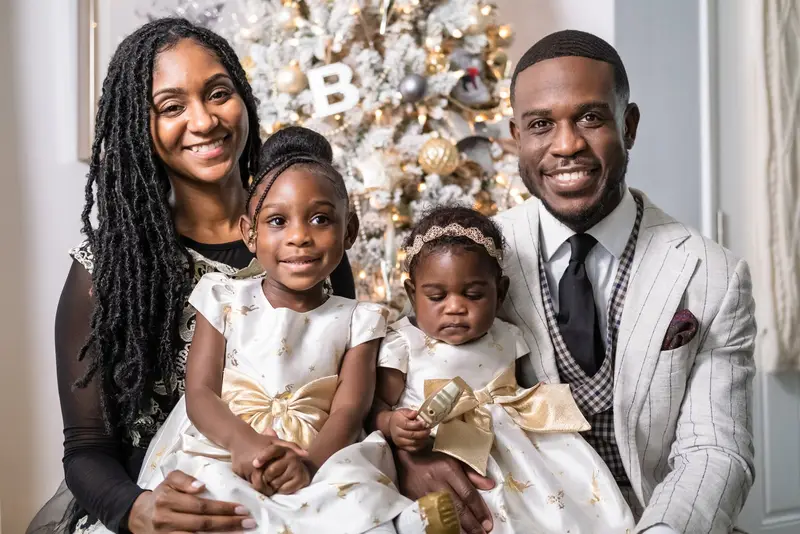 Family of four, Christmas tree