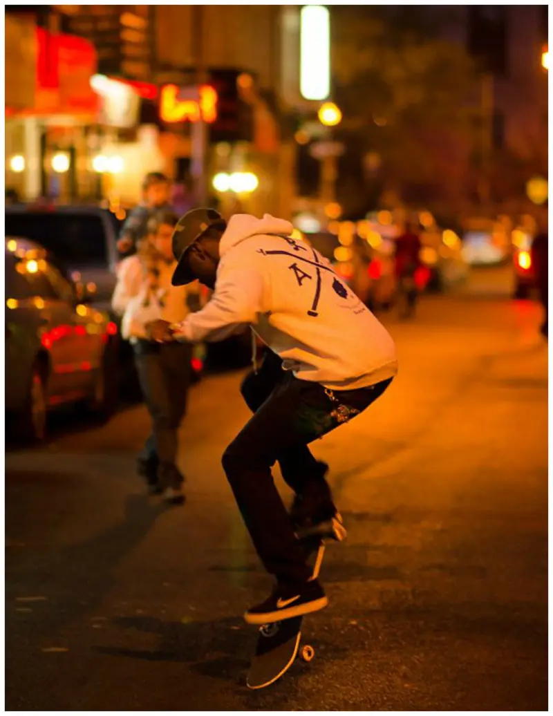 Skater on city street night