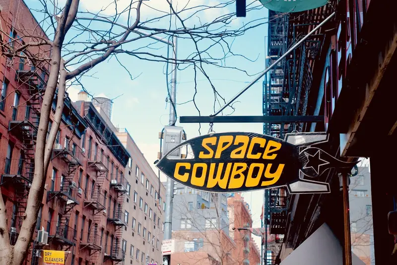 Space Cowboy sign, NYC block
