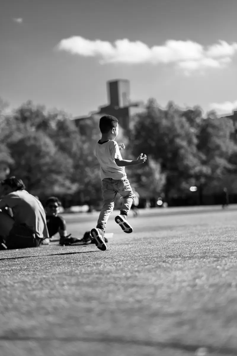 Boy running, black and white