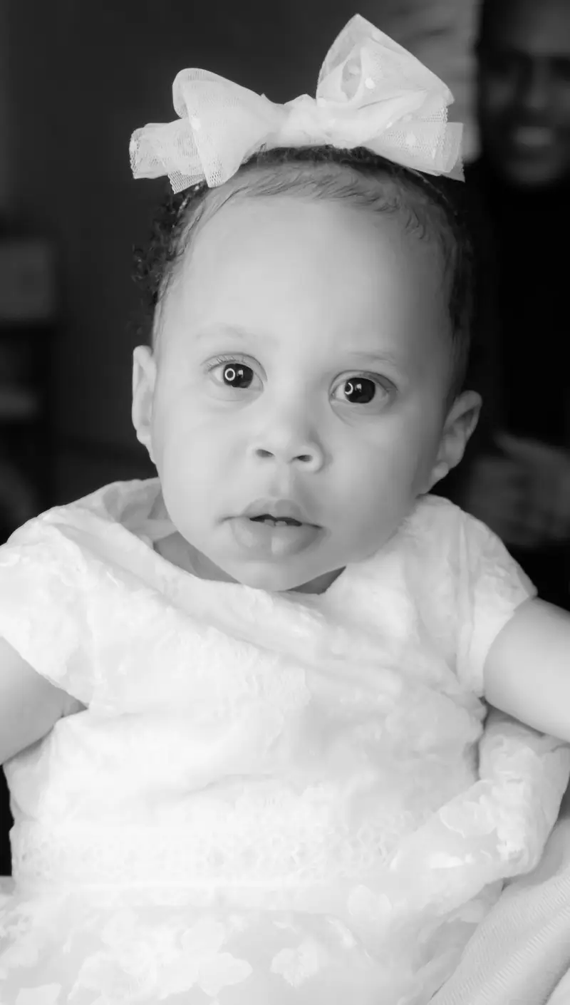 Black and white baby with bow