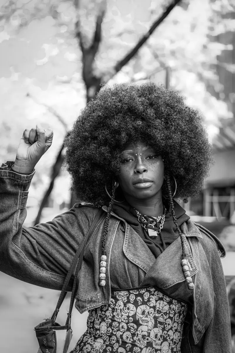 Raised fist, black and white