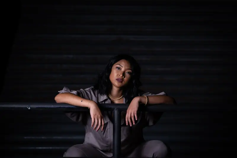 Low-key seated portrait