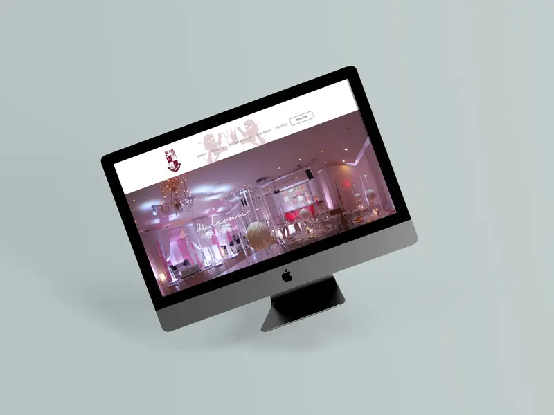 The Royal Chateau Hall website shown on an iMac