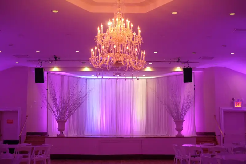 Royal Chateau Hall banquet hall under pink uplighting
