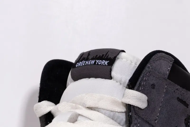 Close detail of a sneaker tongue and lacing