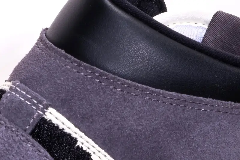 Macro detail of a suede sneaker upper