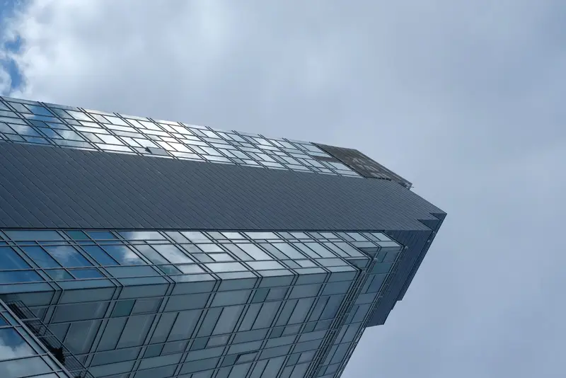 Glass tower against sky